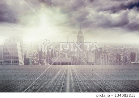 Empty wooden deck stretching toward skyline with spire-topped tower under gray sky, flat design Empty wooden deck stretching toward skyline with spire-topped tower under gray sky, flat design 134082813