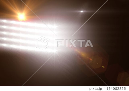 Flat design is showing grid of bright floodlight panels emitting starburst flares on dark backdrop Flat design is showing grid of bright floodlight panels emitting starburst flares on dark backdrop 134082826