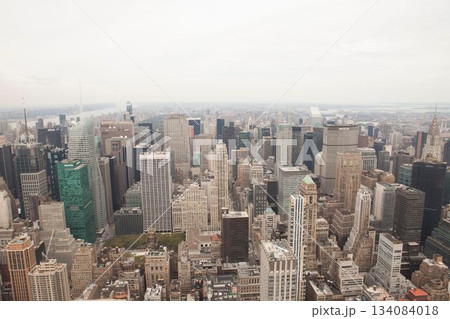Panorama is showing dense skyline in flat design with towers and antennas, river under cloudy sky 134084018
