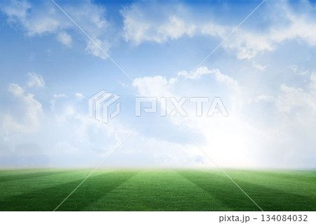 Football pitch under blue sky Football pitch under blue sky 134084032