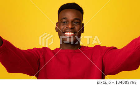 Selfie Time. Cheerful young african american guy making self-portrait and smiling at camera, positive black man taking photo standing isolated over yellow background, closeup shot with free space Selfie Time. Cheerful young african american guy making self-portrait and smiling at camera, positive black man taking photo standing isolated over yellow background, closeup shot with free space 134085768