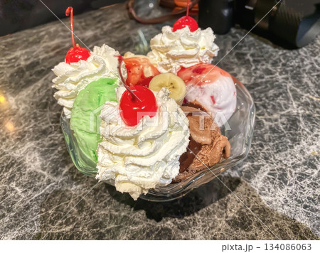 Ice cream sundae with cherries Ice cream sundae with cherries 134086063