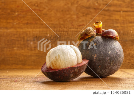 Fresh whole and peeled mangosteen 134086081