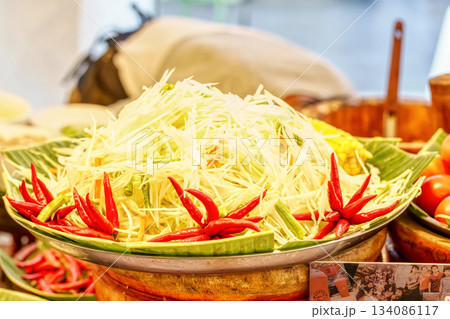 Shredded papaya for spicy salad Shredded papaya for spicy salad 134086117