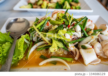 Spicy glass noodle seafood salad 134086129