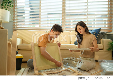 Photo series of young asian couple assembly a new furniture at home Photo series of young asian couple assembly a new furniture at home 134089072