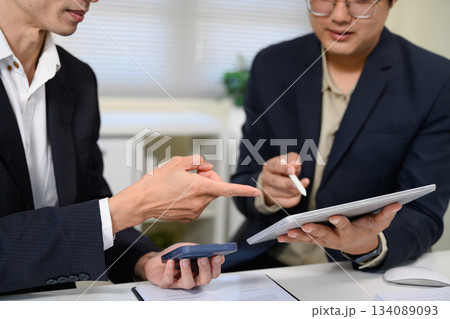 Asian business adviser meeting to analyze and discuss the situation on the financial report Asian business adviser meeting to analyze and discuss the situation on the financial report 134089093