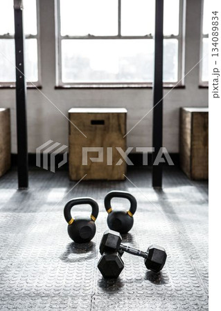 General view of gym with dumbbells on floor, boxes and window 134089834