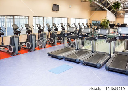 Treadmills and cross trainers in health club Treadmills and cross trainers in health club 134089910