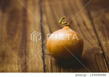 Fresh onion on wooden table 134090066