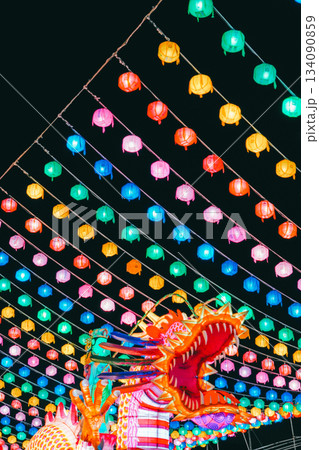 Vibrant Multicolored Lanterns and a 3D Dragon Structure against the Night Sky Vibrant Multicolored Lanterns and a 3D Dragon Structure against the Night Sky 134090859