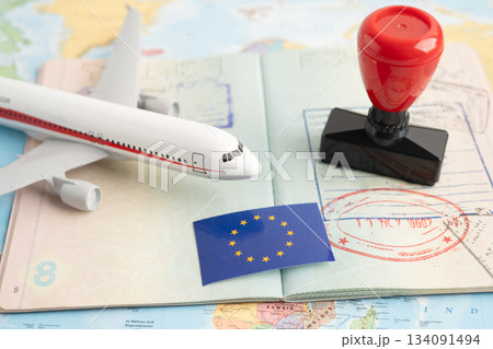 Approved Stamp passport with EU flag document to immigration at airport in country. Approved Stamp passport with EU flag document to immigration at airport in country. 134091494