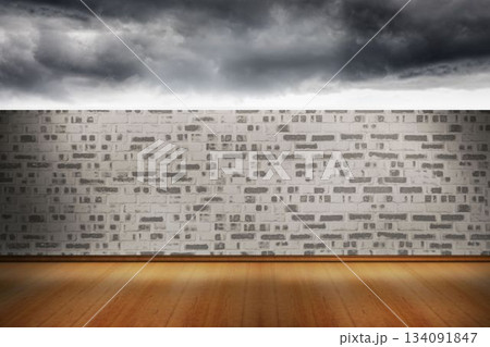 flat design showing interior polished wood floor and whitewashed wall under dark storm clouds flat design showing interior polished wood floor and whitewashed wall under dark storm clouds 134091847