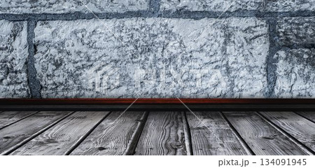 Empty wooden shelf on gray wall 134091945