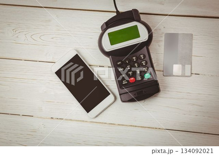 Scene is showing smartphone, payment terminal and credit card on white-painted table in flat design 134092021