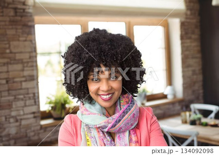 Portrait of curly hair woman at cafe Portrait of curly hair woman at cafe 134092098