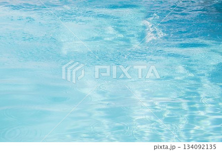 Flat design water surface is shimmering under bright sunlight with subtle ripples and reflections Flat design water surface is shimmering under bright sunlight with subtle ripples and reflections 134092135