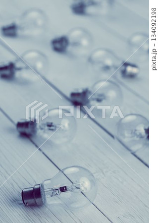 Light bulbs on white floorboard 134092198