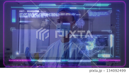 Medical worker scanning holographic interface at lab wearing scrubs mask gloves with pipette 134092499