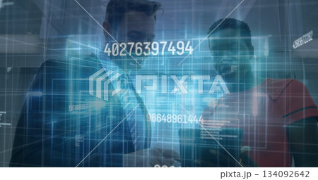 Smiling man in suit viewing smartphone with colleague in red top in lobby, with holographic codes Smiling man in suit viewing smartphone with colleague in red top in lobby, with holographic codes 134092642