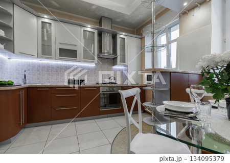 Modern Kitchen Interior with Cabinets, Countertop and Gas Stove Modern Kitchen Interior with Cabinets, Countertop and Gas Stove 134095379