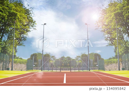 Composite image of tennis field on a sunny day 134095842