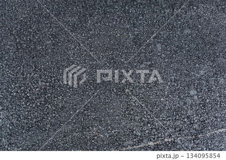 Gravel packed asphalt mixture is being shown in flat design illustration, highlighting loose stones 134095854