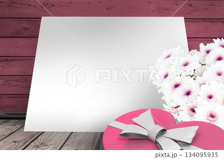 Box and flowers on wooden background Box and flowers on wooden background 134095935