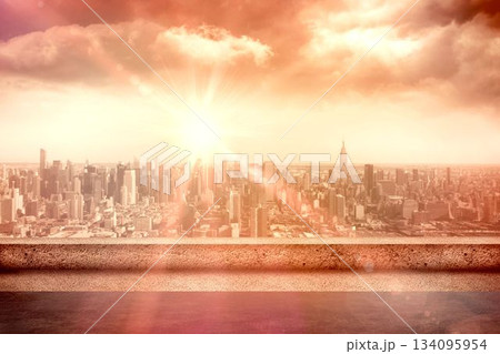 City skyline is glowing under rising sun on concrete terrace ledge, with lens flare flat design City skyline is glowing under rising sun on concrete terrace ledge, with lens flare flat design 134095954