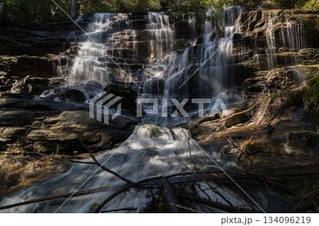 Beautiful waterfall on sunny day Beautiful waterfall on sunny day 134096219