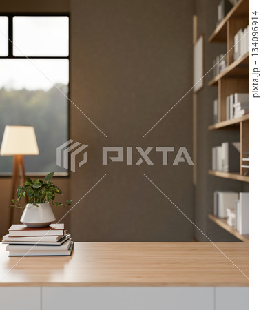 Potted plants atop books on wooden table across window in a living room with bookshelf or a library. Potted plants atop books on wooden table across window in a living room with bookshelf or a library. 134096914