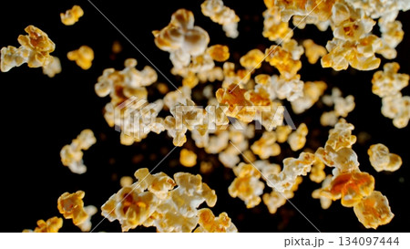 Freeze Motion of Popcorn Falling on Black Background 134097444