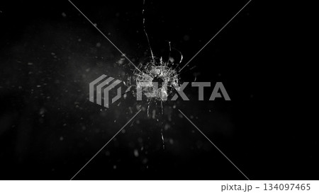 Freeze Motion Shot of Glass Shattered by a Bullet from a Pistol on Black Background 134097465