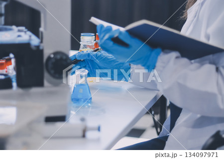 Portrait, science and happy woman on laptop in lab to research chemistry, test or innovation. Microscope, scientist and face of medical doctor in goggles for microbiology, healthcare or pharma study Portrait, science and happy woman on laptop in lab to research chemistry, test or innovation. Microscope, scientist and face of medical doctor in goggles for microbiology, healthcare or pharma study 134097971