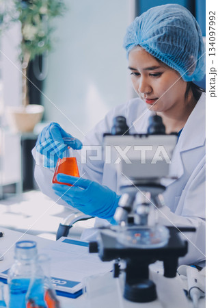 Portrait, science and happy woman on laptop in lab to research chemistry, test or innovation. Microscope, scientist and face of medical doctor in goggles for microbiology, healthcare or pharma study Portrait, science and happy woman on laptop in lab to research chemistry, test or innovation. Microscope, scientist and face of medical doctor in goggles for microbiology, healthcare or pharma study 134097992
