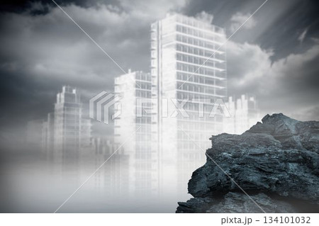 Large rock overlooking outline of city Large rock overlooking outline of city 134101032