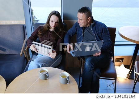Caring Caucasian father man talking teach my daughter at work family care loving daddy parent touching little schoolgirl male dad supporting child bonding daughter guy discussing school trouble 134102164
