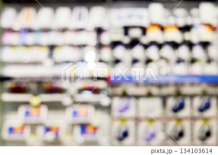 Blurred retail store aisle with merchandise on shelves 134103614