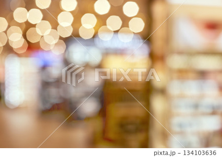 Warm bokeh light creating abstract blurred background in store interior Warm bokeh light creating abstract blurred background in store interior 134103636