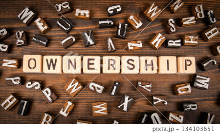 Ownership. Wooden Letter Blocks on Rustic Wooden Surface 134103651