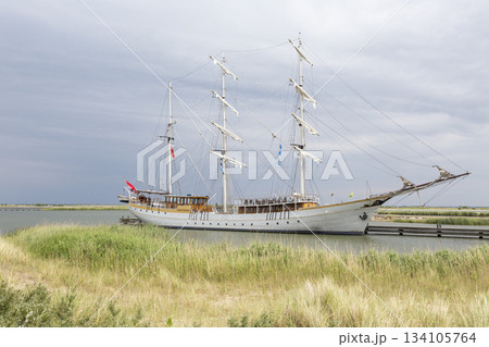 Sailing ship docked at Marker Wadden harbour in the Netherlands during a cloudy day Sailing ship docked at Marker Wadden harbour in the Netherlands during a cloudy day 134105764