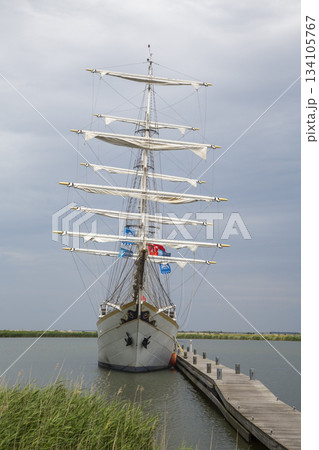 Sailing ship docked at Marker Wadden harbour in the Netherlands during cloudy weather 134105767