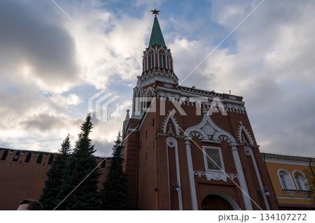 Historic Red Brick Church Tower With Green Spire And Star Over Old Kremlin Wall 134107272