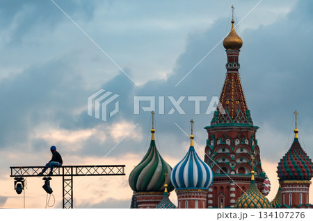 Colorful Saint Basil's Cathedral Domes With Construction Platform And Worker In Moscow Colorful Saint Basil's Cathedral Domes With Construction Platform And Worker In Moscow 134107276