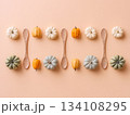 Mini pumpkins and corn on peach background 134108295