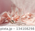 Minimal pastel festive table with crystal glasses and silk napkin 134108298