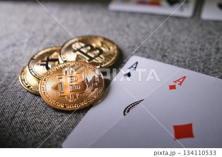 Bitcoin cryptocurrency coins with two playing cards 134110533