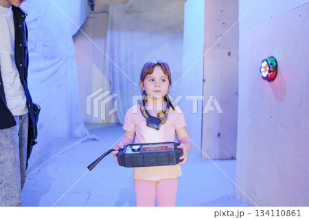 Child exploring a colorful indoor play area with excitement Child exploring a colorful indoor play area with excitement 134110861