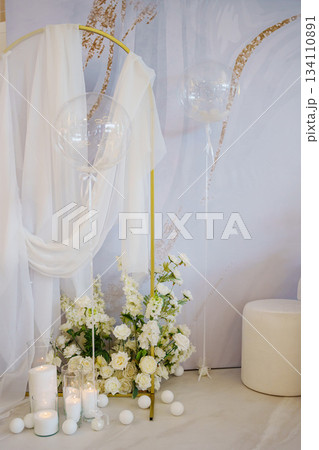 Elegant ceremony backdrop with white flowers and decor Elegant ceremony backdrop with white flowers and decor 134110891