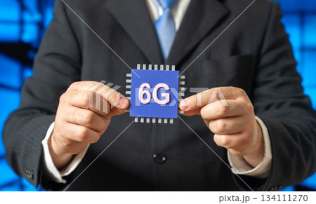 The new 6G microchip in the hands of a businessman. An innovative communication standard. Internet of Things. Ultra fast connectivity and network evolution. Telecom, IoT infrastructure development The new 6G microchip in the hands of a businessman. An innovative communication standard. Internet of Things. Ultra fast connectivity and network evolution. Telecom, IoT infrastructure development 134111270